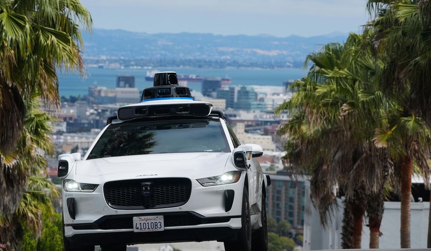 A Waymo car drives up a hill in San Francisco, Sept. 4, 2025. (AP Photo/Jeff Chiu, File)