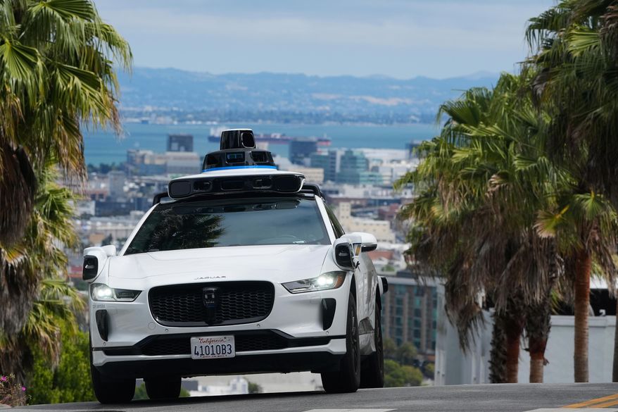 A Waymo car drives up a hill in San Francisco, Sept. 4, 2025. (AP Photo/Jeff Chiu, File)