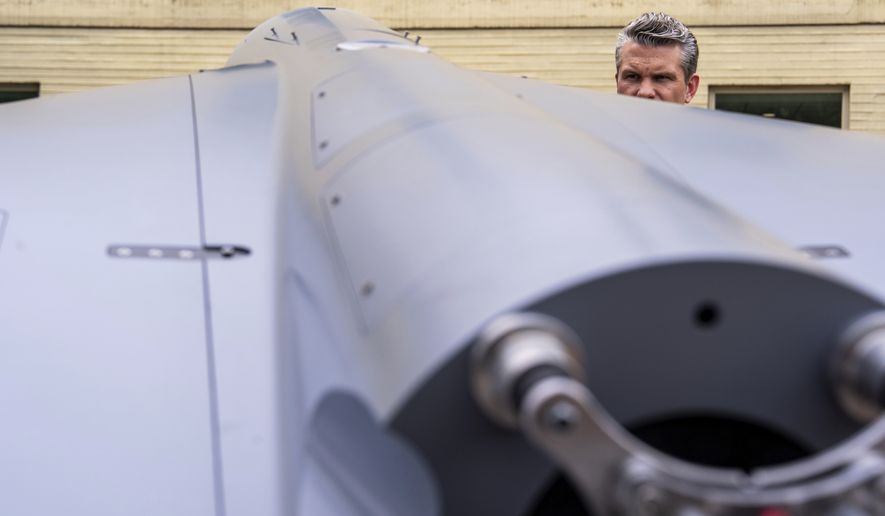 Secretary of Defense Pete Hegseth looks at a drone while touring a display of multi-domain autonomous systems in the Pentagon courtyard in Arlington, Va., on Wednesday, July 16, 2025. (AP Photo/Julia Demaree Nikhinson) **FILE**