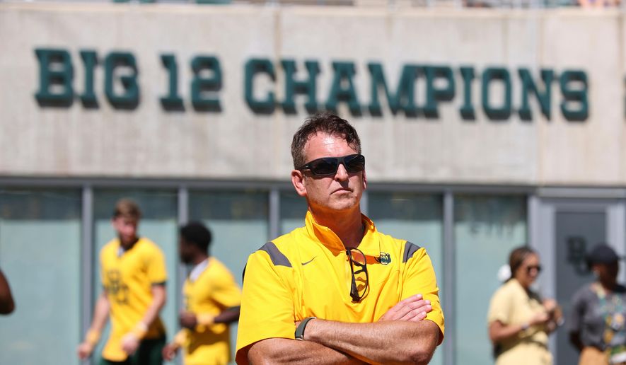 FILE - Baylor athletic director Mack Rhoades looks on from the sideline during an NCAA college football game against BYU, Saturday, Sept. 28, 2024, in Waco, Texas. (AP Photo/Jerry Larson, File)