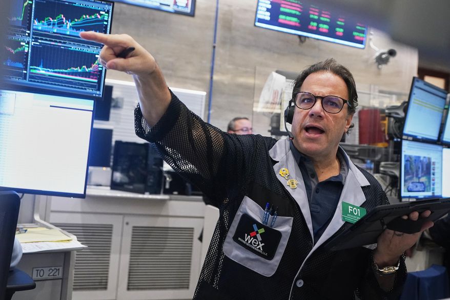 Options trader Anthony Spina works on the floor of the New York Stock Exchange, Wednesday, Nov. 12, 2025. (AP Photo/Richard Drew)