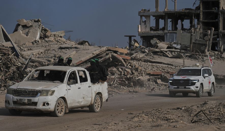 Hamas militants accompanied by members of the International Committee of the Red Cross (ICRC) head to east of Gaza City to search for the bodies of hostages, Thursday, Nov. 13, 2025. (AP Photo/Jehand Alshrafi)