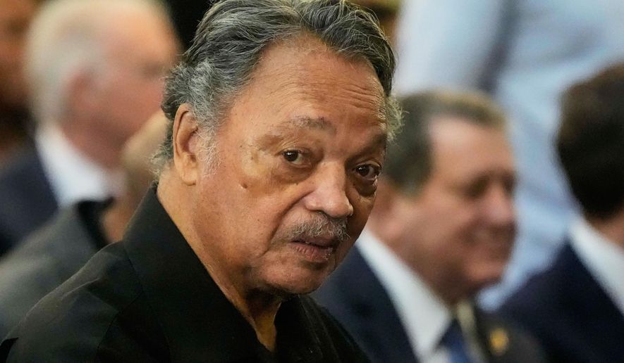 FILE - The Rev. Jesse Jackson listens to speakers at the Tabernacle Baptist Church during the 60th anniversary of the march to ensure that African Americans could exercise their constitutional right to vote, March 9, 2025, in Selma, Ala. (AP Photo/Mike Stewart, File)