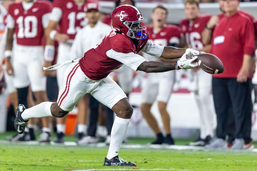 Alabama wide receiver Germie Bernard (5) just misses a fingertip catch during the second half of an NCAA college football game against LSU, Saturday, Nov. 8, 2025, in Tuscaloosa, Ala. (AP Photo/Vasha Hunt)