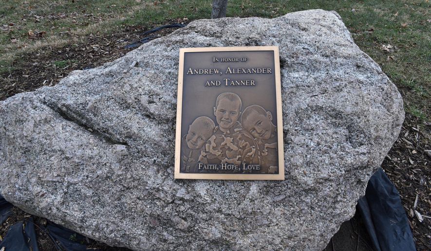 FILE - This plaque honors the missing Skelton brothers in the municipal park on the banks of Bean Creek in Morenci, Mich., on Jan. 27, 2017. (Dale G. Young/Detroit News via AP, file)