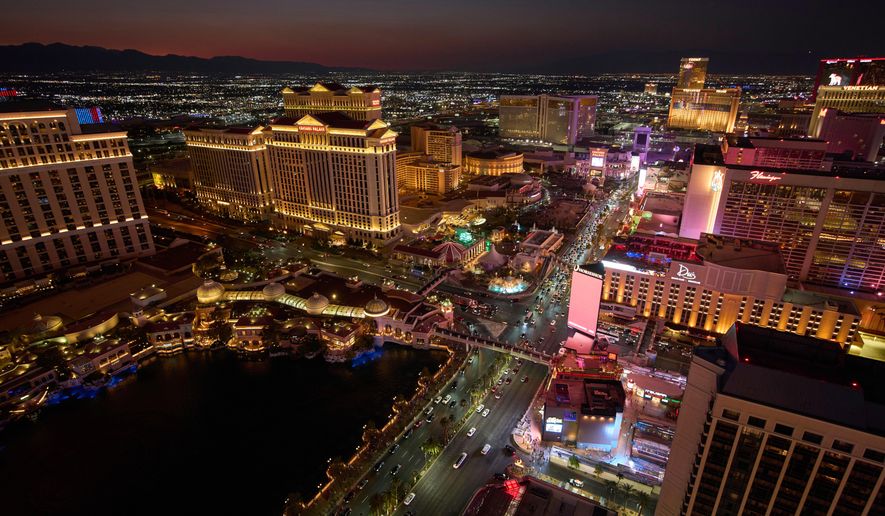 FILE - Cars drive along the Las Vegas Strip, Aug. 2, 2025, in Las Vegas. (AP Photo/John Locher, File)