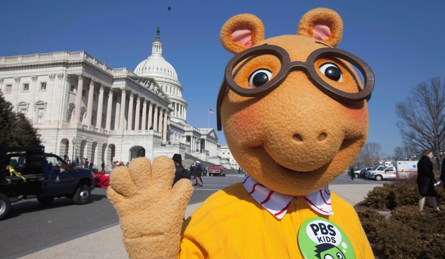 FILE - Arthur the Aardvark waves on Capitol Hill in Washington, Feb. 16, 2011, during a news conference to discuss the future of public broadcasting. (AP Photo/Harry Hamburg, File)