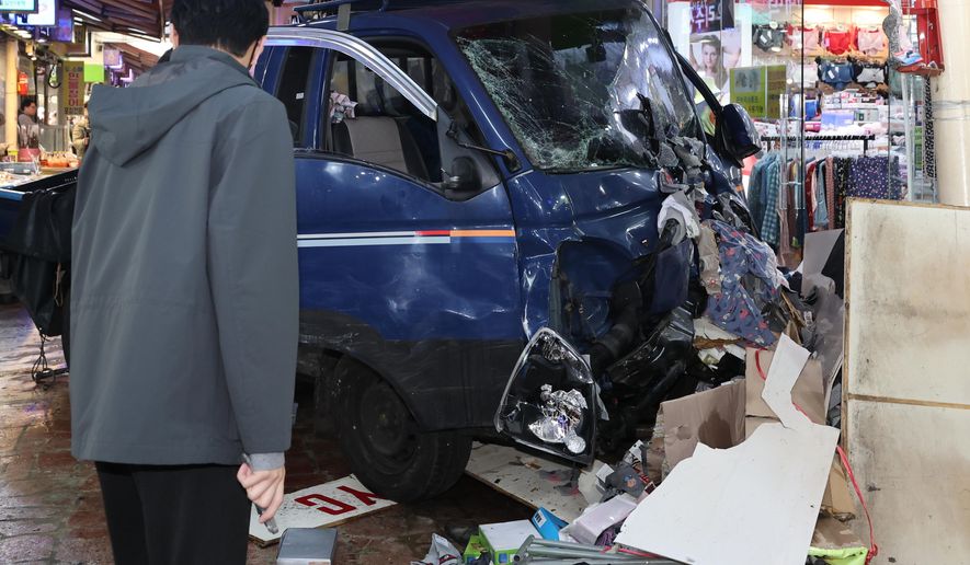 A truck crashes at a market in Bucheon, South Korea, Thursday, Nov. 13, 2025. (Lim Soon-suck/Yonhap via AP)