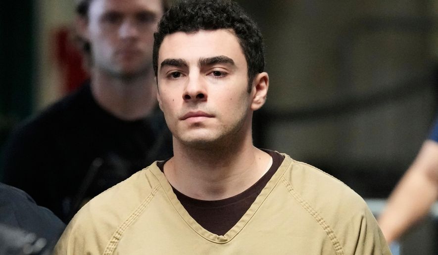 Luigi Mangione is escorted into Manhattan state court in New York, Sept. 16, 2025. (AP Photo/Seth Wenig, file)