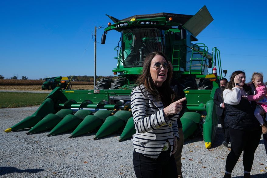 U.S. Secretary of Agriculture Brooke L. Rollins, right, speaks during a farm tour in Lebanon, Ind., Thursday, Oct. 30, 2025. (AP Photo/Michael Conroy)