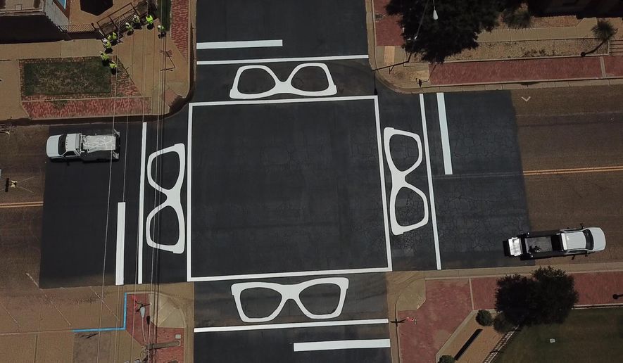 This photo provided by City of Lubbock on Friday, Nov. 14, 2025, shows the Buddy Holly Crosswalk in Lubbock, Texas. (City of Lubbock via AP)