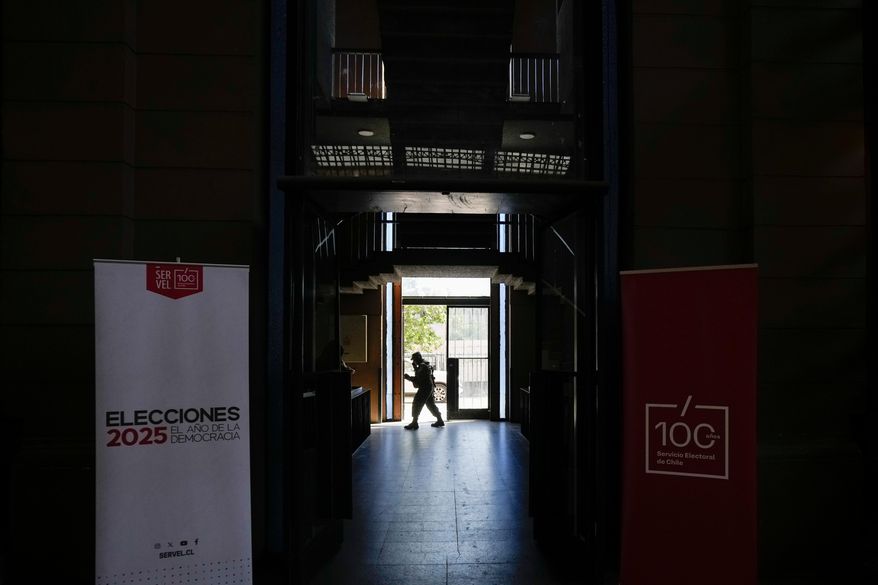 Soldier guard the old Mapocho train station, now a cultural center, that will be used as a polling station for the general election in Santiago, Chile, Friday, Nov. 14, 2025. (AP Photo/Esteban Felix)