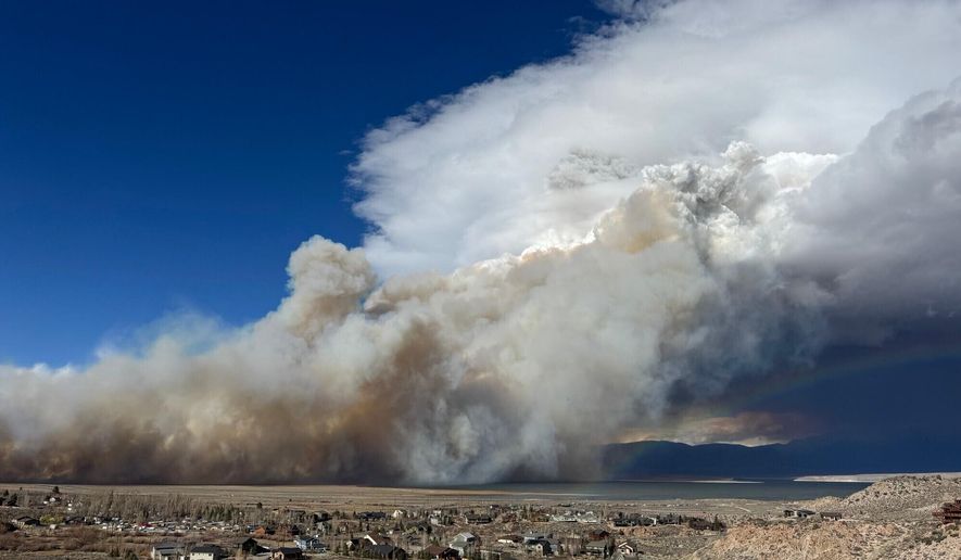 This image released by the Mammoth Lakes Police Department shows the Pack Fire burning on Thursday, Nov. 13, 2025, in Mono County, Calif. (Mammoth Lakes Police Department via AP)