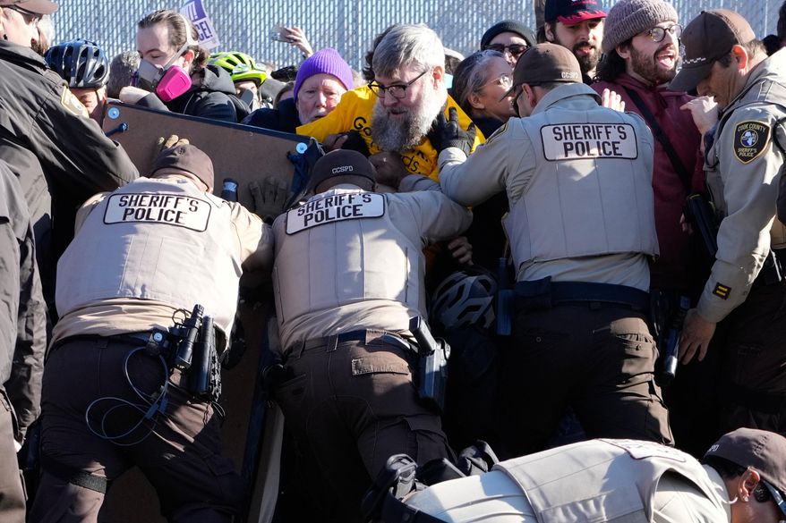 Cook County Sheriff Police guard protesters outside an ICE processing facility in the Chicago suburb of Broadview, Ill., Friday, Nov. 14, 2025. (AP Photo/Nam Y. Huh) **FILE**