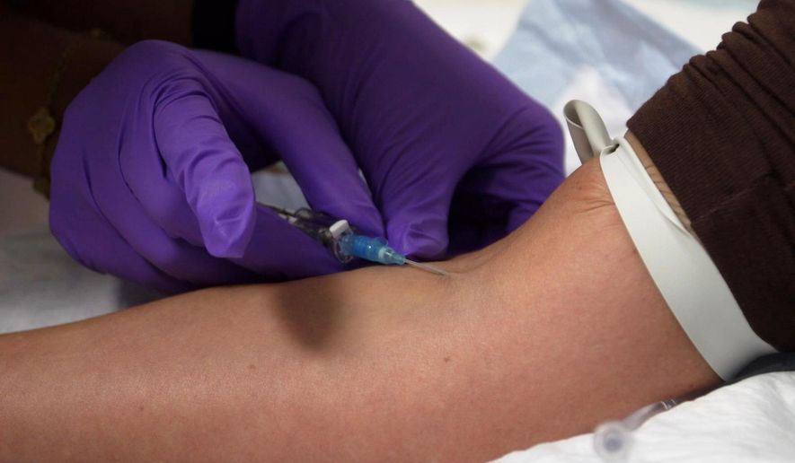 In this image taken from video, an IV infusion is administered at Pure Alchemy Wellness, Tuesday, Nov. 11, 2025, in Chula Vista, Calif. (AP Photo/Javier Arciga)