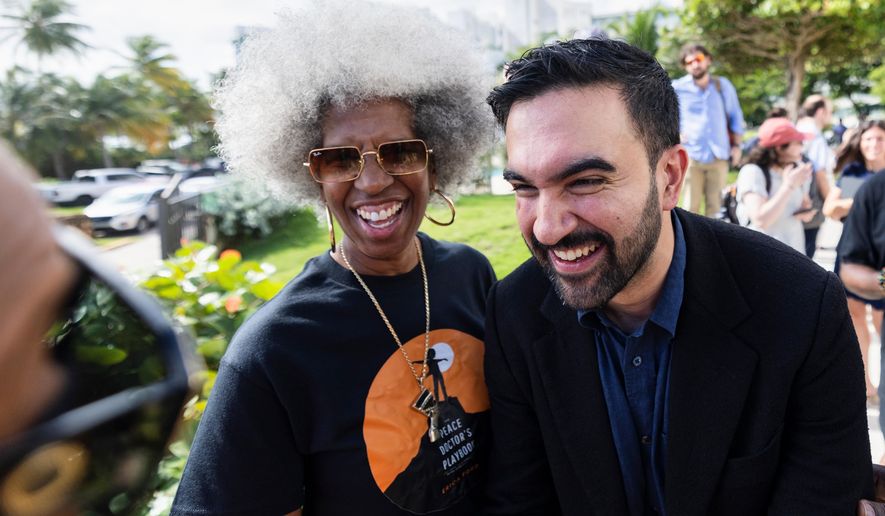 New York City Mayor-elect Zohran Mamdani greets people while attending the SOMOS Puerto Rico conference in San Juan, Puerto Rico, Saturday, Nov. 8, 2025. (AP Photo/Alejandro Granadillo)