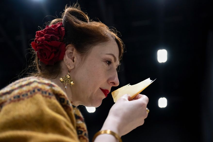 A Member of the jury analyzes and tastes cheeses from different countries, during the 37th World Cheese Awards, at the Festhalle in Bern, Switzerland, Thursday, Nov. 13, 2025. (Anthony Anex/Keystone via AP)