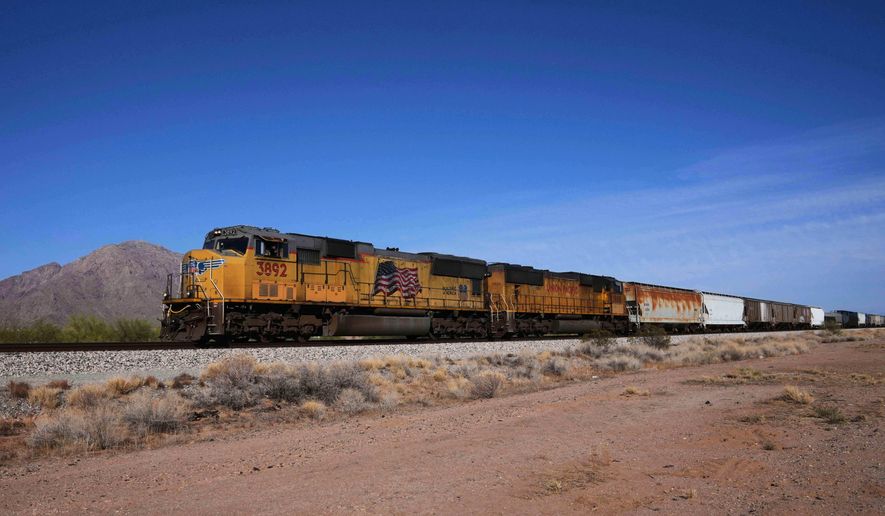 A Union Pacific freight train travels along the tracks April 17, 2025, in Eloy, Ariz. (AP Photo/Ross D. Franklin, File)