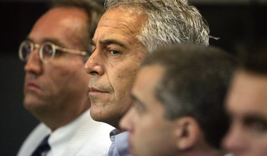In this July 30, 2008, photo, Jeffrey Epstein, center, appears in court in West Palm Beach, Fla. (Uma Sanghvi/The Palm Beach Post via AP) ** FILE **