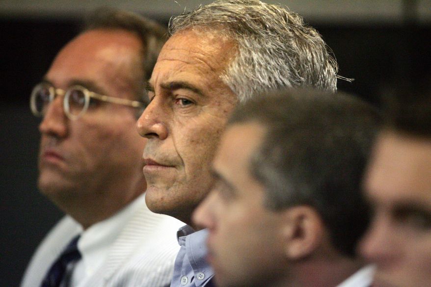 In this July 30, 2008, photo, Jeffrey Epstein, center, appears in court in West Palm Beach, Fla. (Uma Sanghvi/The Palm Beach Post via AP) ** FILE **