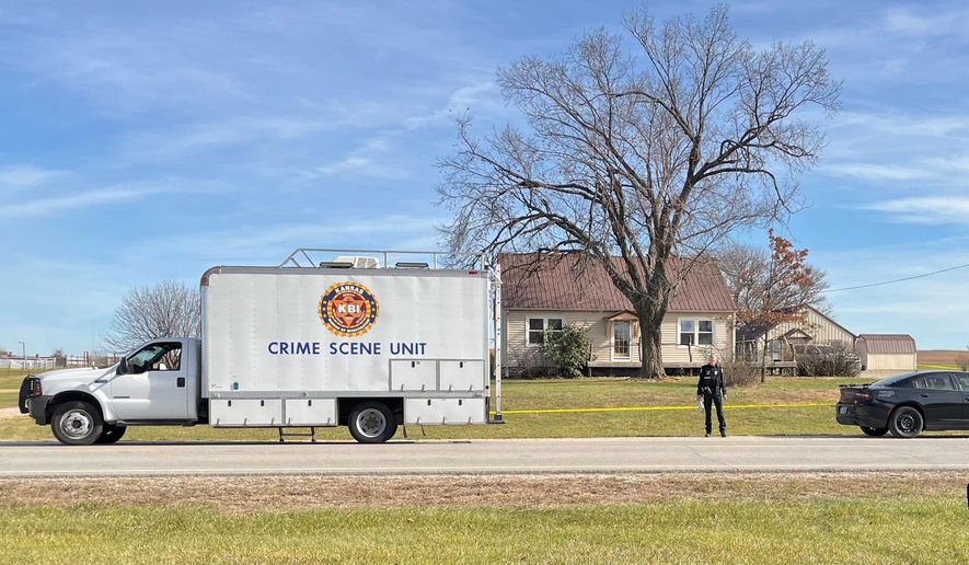 This photo provided by the Kansas Bureau of Investigation shows a crime scene truck parked in front of the home where a domestic violence incident resulted in multiple casualties, Saturday, Nov. 15, 2025, in Carbondale, Kan. (Kansas Bureau of Investigation via AP)