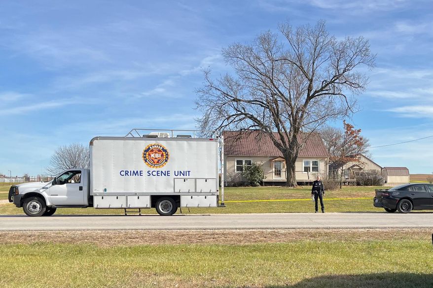 This photo provided by the Kansas Bureau of Investigation shows a crime scene truck parked in front of the home where a domestic violence incident resulted in multiple casualties, Saturday, Nov. 15, 2025, in Carbondale, Kan. (Kansas Bureau of Investigation via AP)