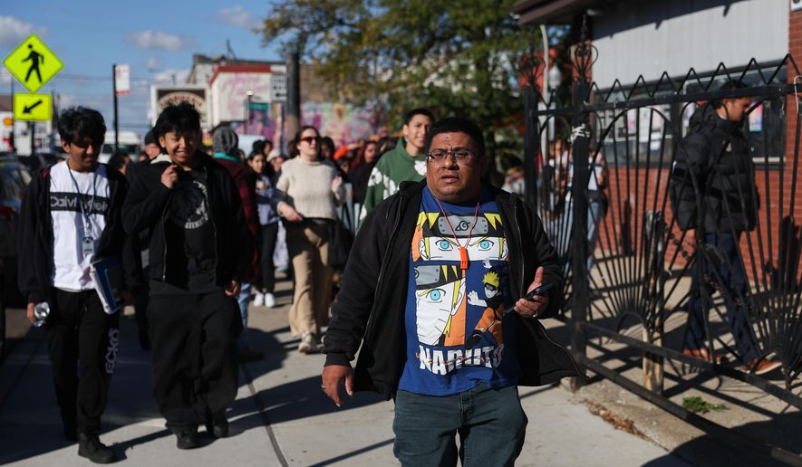 Baltazar Enriquez, president of the Little Village Community Council, walks with a Chicago Public School's student walkout in protest against U.S. Immigration and Customs Enforcement (ICE) agents around Chicago's Little Village neighborhood, Wednesday, Oct. 29, 2025. (AP Photo/Talia Sprague)