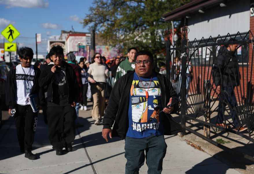 Baltazar Enriquez, president of the Little Village Community Council, walks with a Chicago Public School's student walkout in protest against U.S. Immigration and Customs Enforcement (ICE) agents around Chicago's Little Village neighborhood, Wednesday, Oct. 29, 2025. (AP Photo/Talia Sprague)
