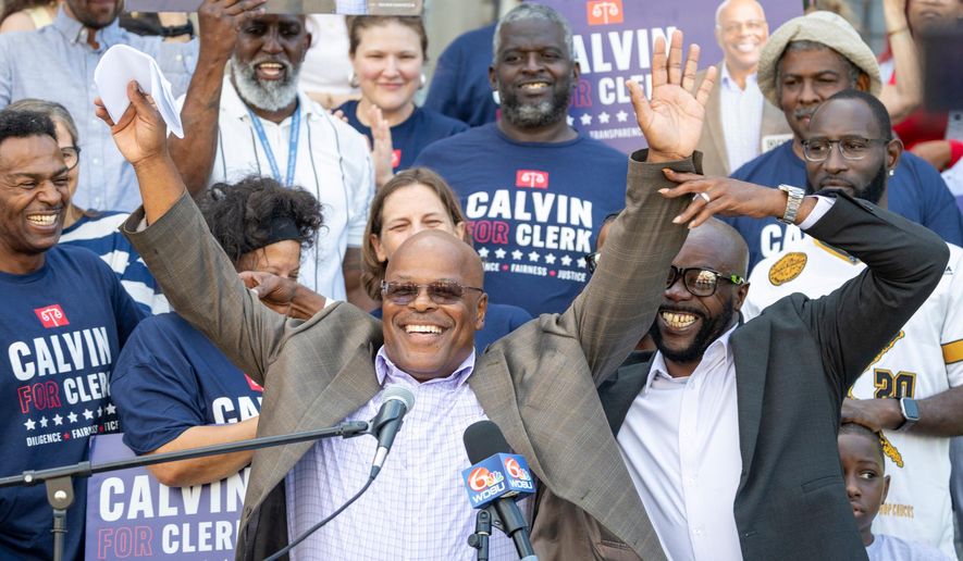 FILE - Calvin Duncan, center, stands with supporters on the steps of Orleans Parish Criminal Court to speak about his ambitions to be the next Clerk of Court, Oct. 2, 2025. (Chris Granger/The Times-Picayune/The New Orleans Advocate via AP, File)
