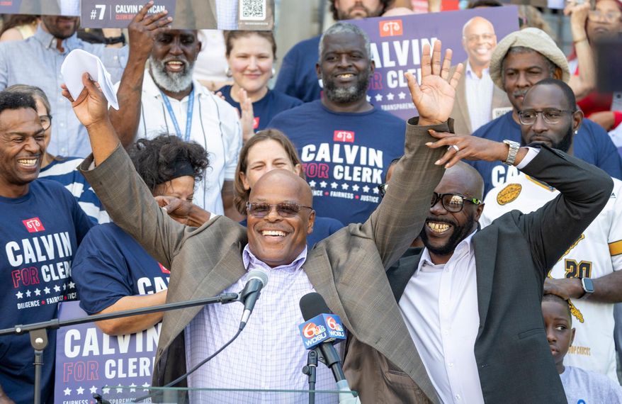 FILE - Calvin Duncan, center, stands with supporters on the steps of Orleans Parish Criminal Court to speak about his ambitions to be the next Clerk of Court, Oct. 2, 2025. (Chris Granger/The Times-Picayune/The New Orleans Advocate via AP, File)