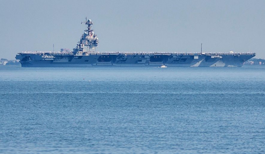 FILE The USS Gerald R. Ford aircraft carrier leaves Naval Station Norfolk, June 23, 2025, in Norfolk, Va. (AP Photo/John Clark, File)