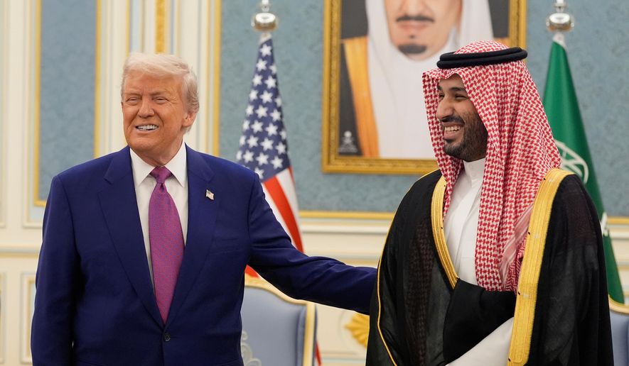 President Donald Trump and Saudi Crown Prince Mohammed bin Salman gesture as they meet delegations at the Royal Palace in Riyadh, Saudi Arabia, May 13, 2025. (AP Photo/Alex Brandon, File)