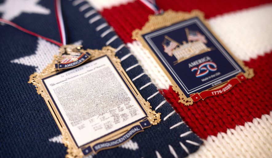 The front and back of a commemorative ornament released by America250 as part of events leading up to the 250th anniversary of the signing of the Declaration of Independence in 1776, is photographed Thursday, Nov. 13, 2025, in Washington. (AP Photo/Mark Schiefelbein)