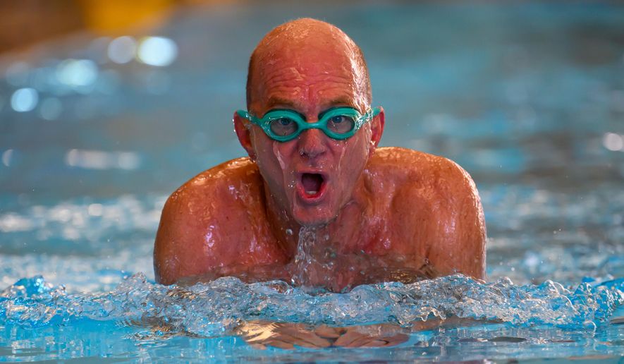 Former Olympic swimmer Rowdy Gaines swims, Tuesday, Nov 11, 2025 at a pool in Salt Lake City. (AP Photo/Tyler Tate)