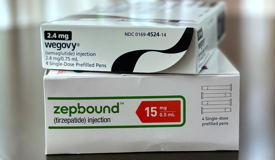 FILE - Boxes for the medications Wegovy and Zepbound are arranged for a photograph in California on May 8, 2025. (AP Photo/JoNel Aleccia, File)