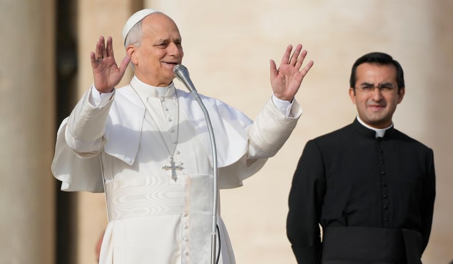 Pope Leo XIV waves to faithful before presiding over special mass for the Jubilee of the poor, in St. Peter's Square at The Vatican, Sunday, Nov.16, 2025. (AP Photo/Gregorio Borgia)