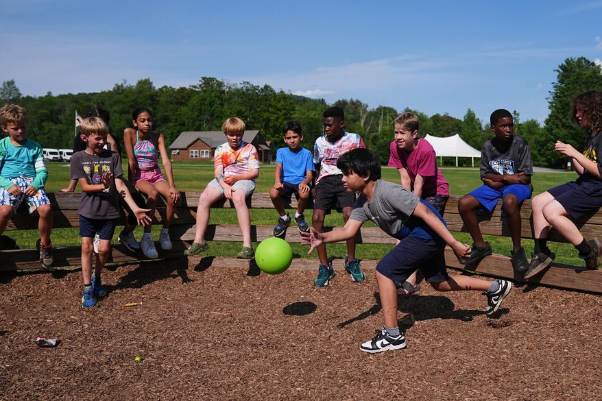 Dylan Aristy Mota, 12, of New York City, who has lupus, plays a game of Gaga Ball with fellow campers at the Frost Valley YMCA sleepaway camp in Claryville, N.Y., Wednesday, July 30, 2025. The camp partnered with Children's Hospital at Montefiore so kids with autoimmune diseases could attend for the first time. (AP Photo/Matt Rourke)