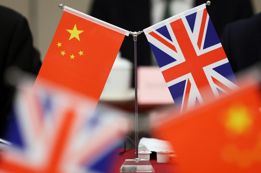Flags of China and the Union Jack stand during the China-U.K. Energy Dialogue in Beijing, China, March 17, 2025. (Florence Lo/Pool Photo via AP, file)