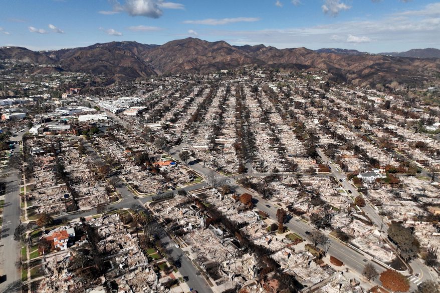 FILE - The devastation from the Palisades Fire is shown in an aerial view in the Pacific Palisades neighborhood of Los Angeles, Jan. 27, 2025. (AP Photo/Jae C. Hong, file)