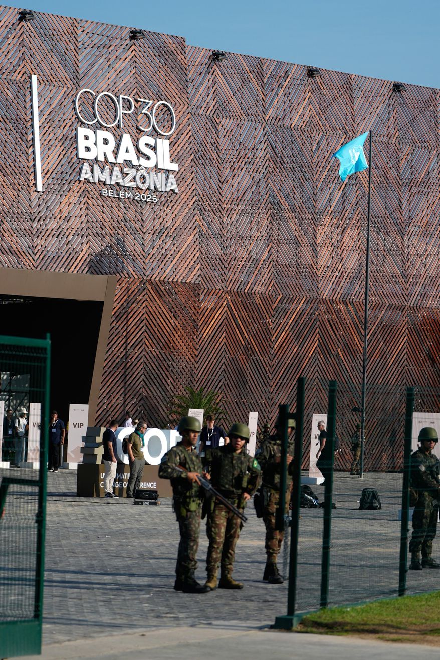 Security personnel work outside the venue for the COP30 U.N. Climate Summit, Monday, Nov. 17, 2025, in Belem, Brazil. (AP Photo/Fernando Llano)