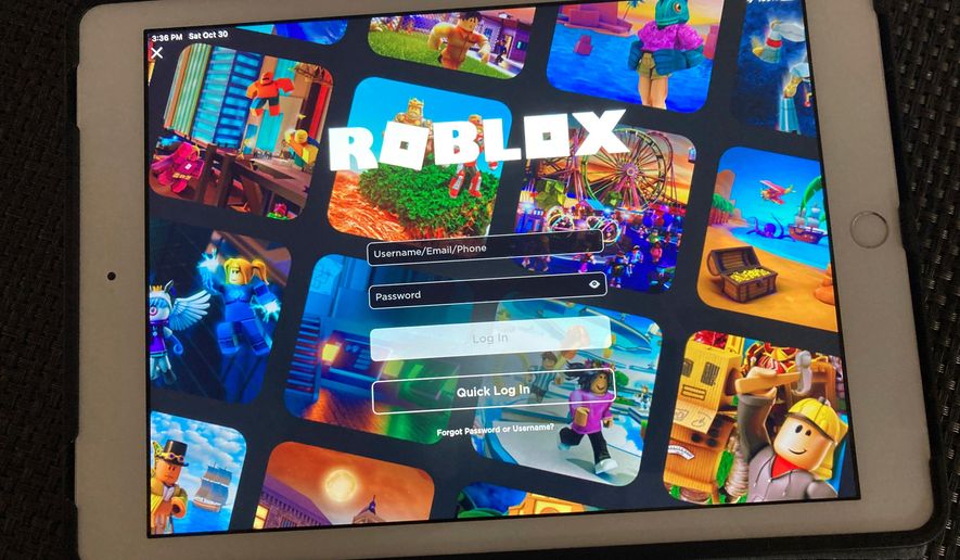 FILE - The gaming platform Roblox is displayed on a tablet, Oct. 30, 2021, in New York. (AP Photo/Leon Keith, File)