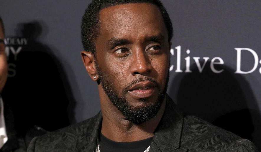 Sean Combs arrives at the Pre-Grammy Gala And Salute To Industry Icons at the Beverly Hilton Hotel, Jan. 25, 2020, in Beverly Hills, Calif. (Photo by Mark Von Holden/Invision/AP, File)