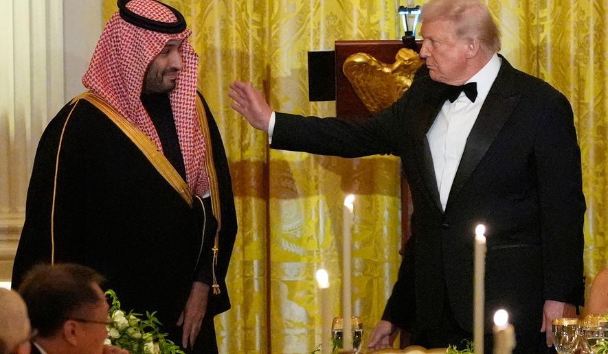 President Donald Trump and Saudi Arabia's Crown Prince Mohammed bin Salman prepare to take their seats during a dinner in the East Room of the White House, Tuesday, Nov. 18, 2025, in Washington. (AP Photo/Alex Brandon)