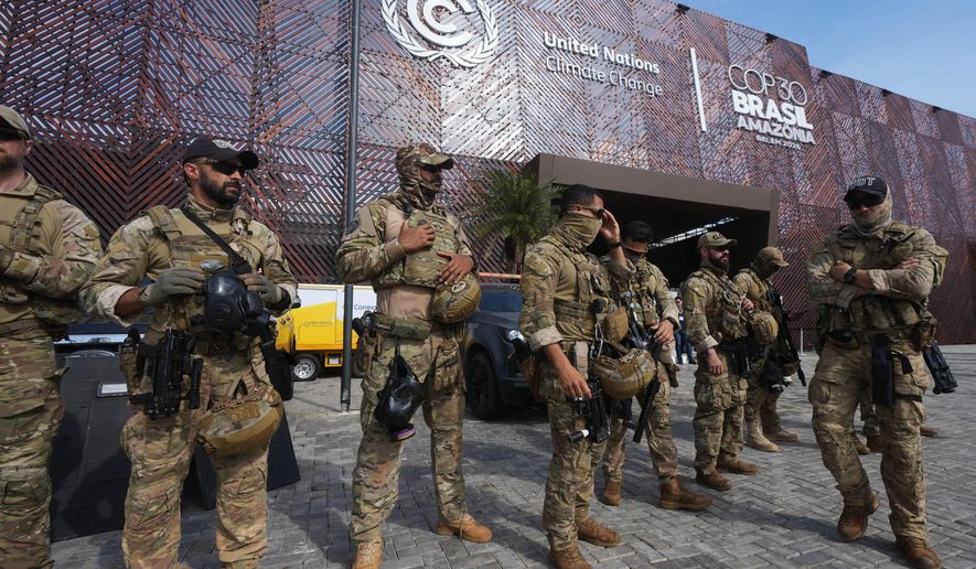 Security personnel work outside an entrance to the COP30 U.N. Climate Summit, Wednesday, Nov. 19, 2025, in Belem, Brazil. (AP Photo/Andre Penner)