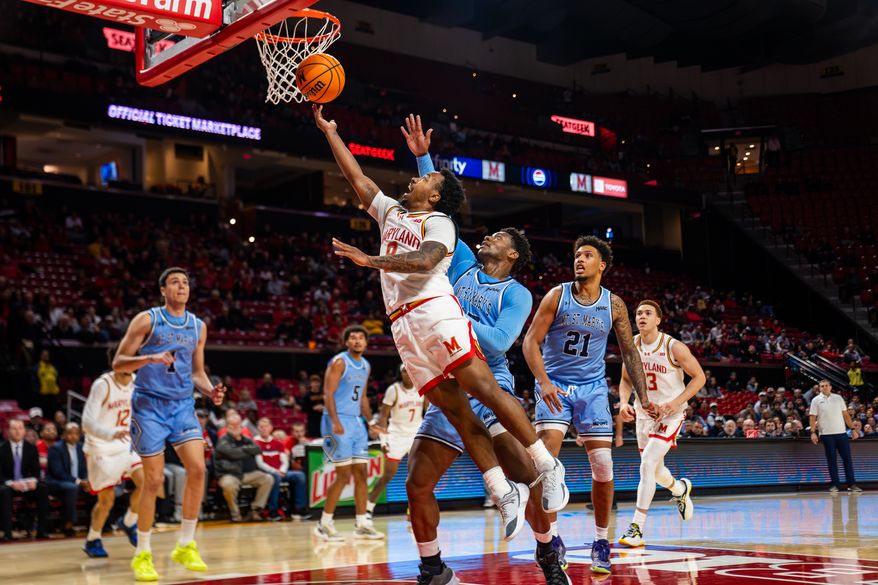 Maryland guard Diggy Coit (8) drives for a layup in an NCAA men's basketball game against Mount St. Mary's, Wednesday, Nov. 19, 2025 at Xfinity Center in College Park, Md. (All-Pro Reels/Andrew Banez)
