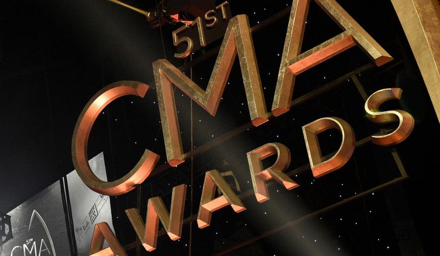 FILE - Signage for the 51st annual CMA Awards appears at the Bridgestone Arena on Nov. 8, 2017, in Nashville, Tenn. (Photo by Chris Pizzello/Invision/AP, File)