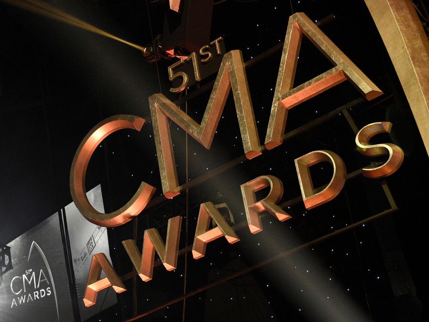 FILE - Signage for the 51st annual CMA Awards appears at the Bridgestone Arena on Nov. 8, 2017, in Nashville, Tenn. (Photo by Chris Pizzello/Invision/AP, File)