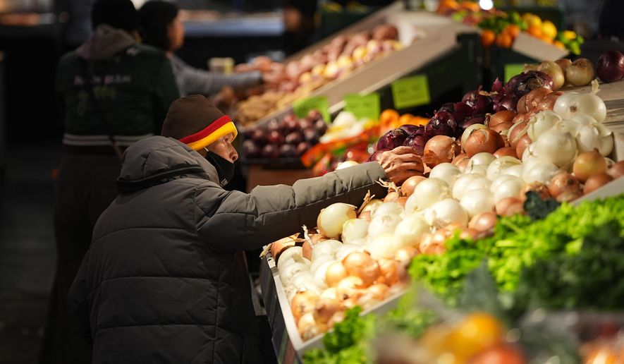 Customers shop at the Reading Terminal Market in Philadelphia, Wednesday, Oct. 29, 2025. (AP Photo/Matt Rourke)