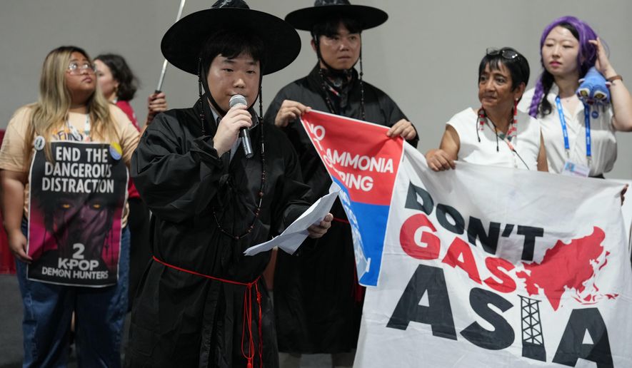 Activists participate in a demonstration calling for South Korea to stop funding fossil fuels during a Don't Gas Asia protest at the COP30 U.N. Climate Summit, Monday, Nov. 17, 2025, in Belem, Brazil. (AP Photo/Andre Penner)
