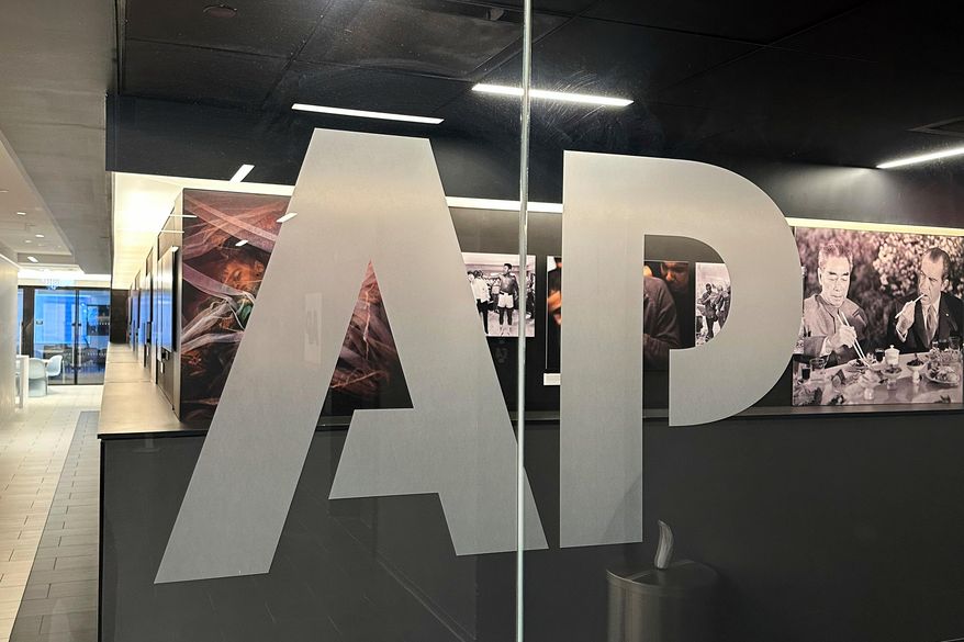 FILE - The Associated Press logo is displayed at the news organization's world headquarters in New York on April 9, 2025. (AP Photo/Aaron Jackson, File)